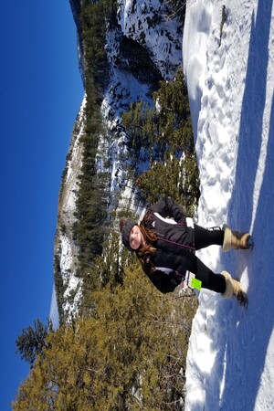 a woman standing in the snow
