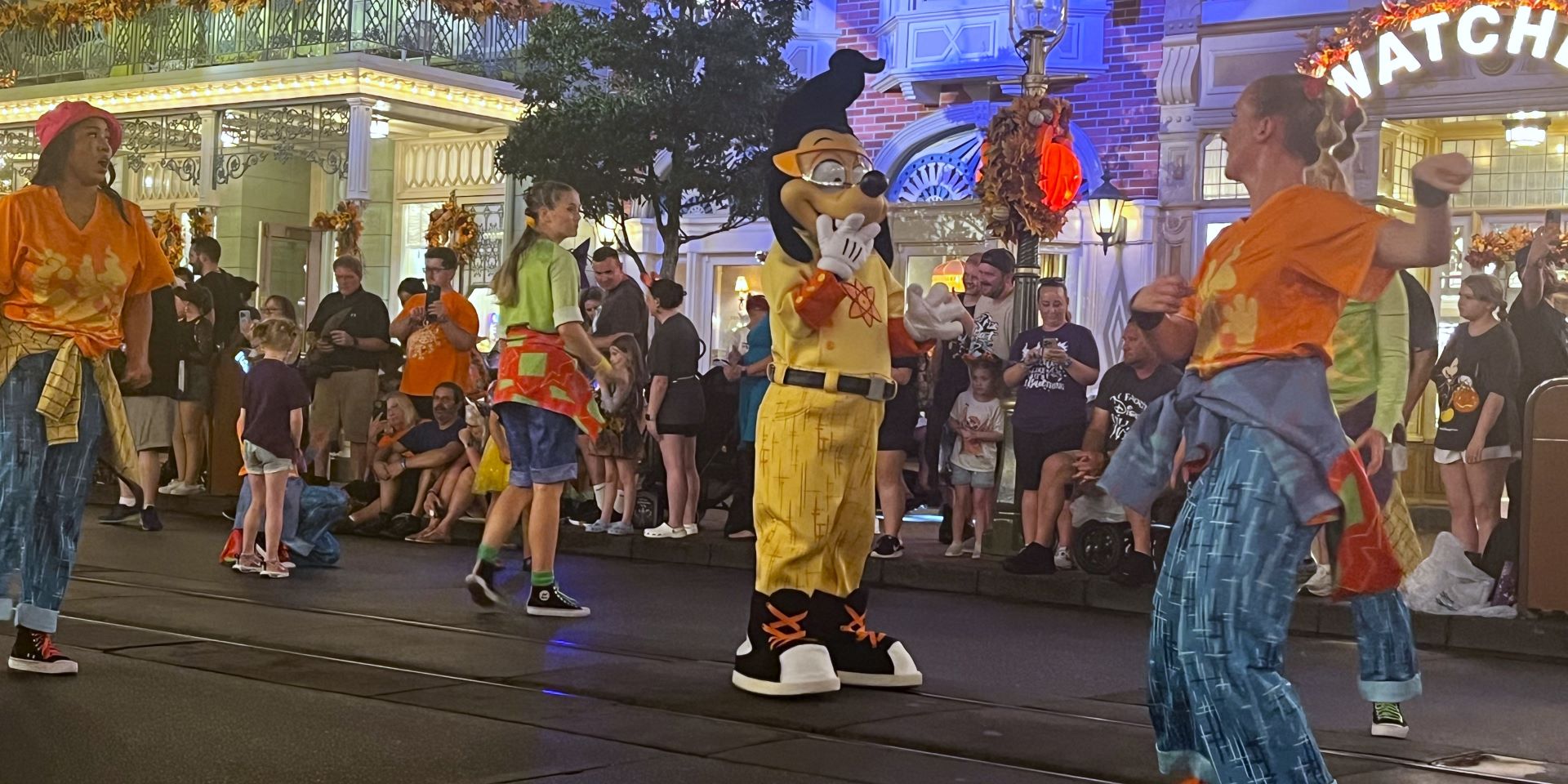 people in clothing on a street