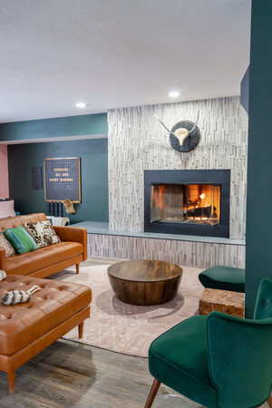 a living room with a fireplace and couches